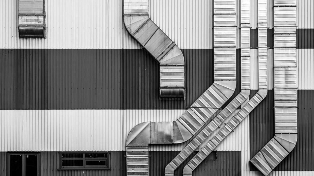 technicien PRO COOLING intervenant sur une installation de réfrigération industrielle à Bruxelles.