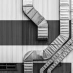 technicien PRO COOLING intervenant sur une installation de réfrigération industrielle à Bruxelles.